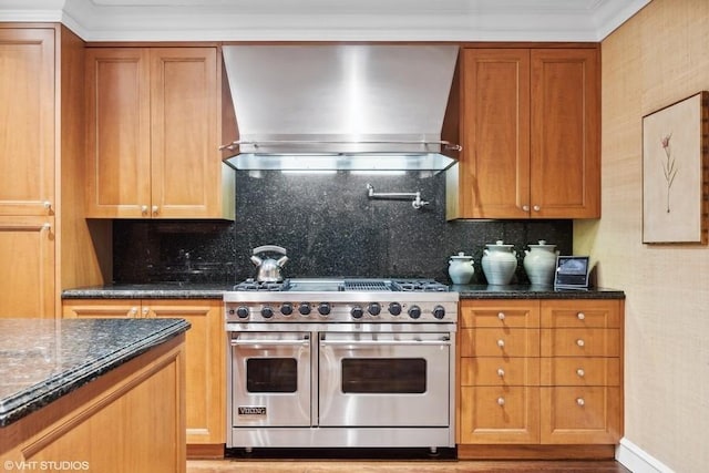219 E Lake Shore Dr Unit 2Abc, Chicago, IL 60611 - kitchen featuring double oven range, extractor fan, brown cabinets, and tasteful backsplash