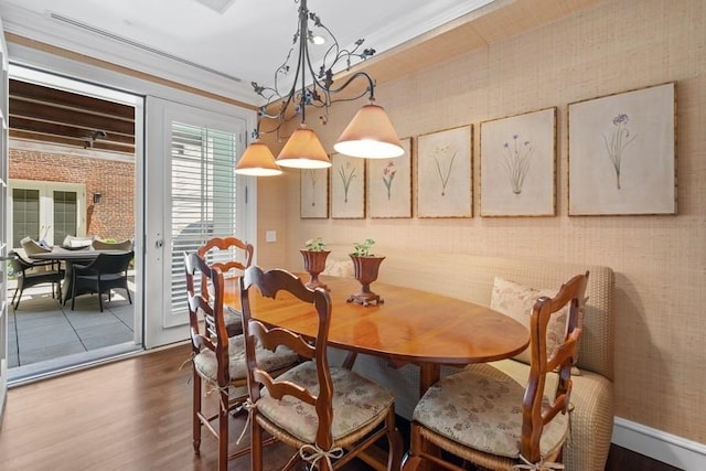 219 E Lake Shore Dr Unit 2Abc, Chicago, IL 60611 - dining room featuring wood finished floors, ornamental molding, and a chandelier