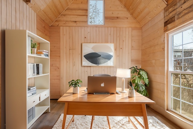 office area with wood ceiling, vaulted ceiling, wooden walls, and wood finished floors