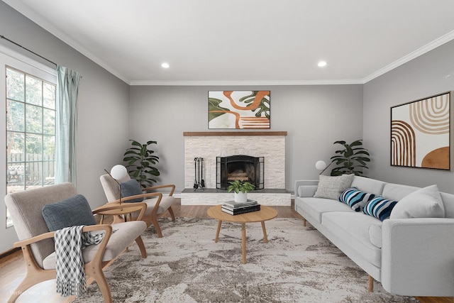 living area featuring recessed lighting, a fireplace, crown molding, and wood finished floors