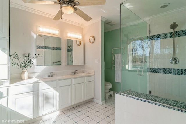 full bath featuring visible vents, double vanity, a stall shower, a sink, and crown molding