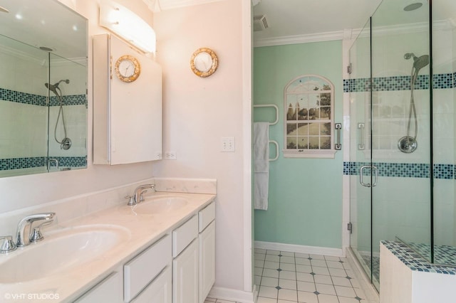 bathroom featuring crown molding, double vanity, a shower stall, and a sink