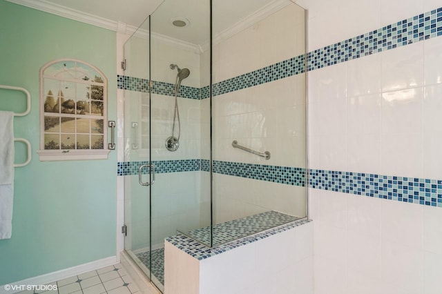 full bath with a stall shower, baseboards, ornamental molding, and tile patterned flooring