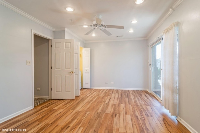 spare room featuring recessed lighting, light wood-type flooring, baseboards, and crown molding