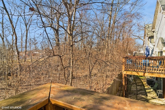 view of yard with a wooden deck and cooling unit