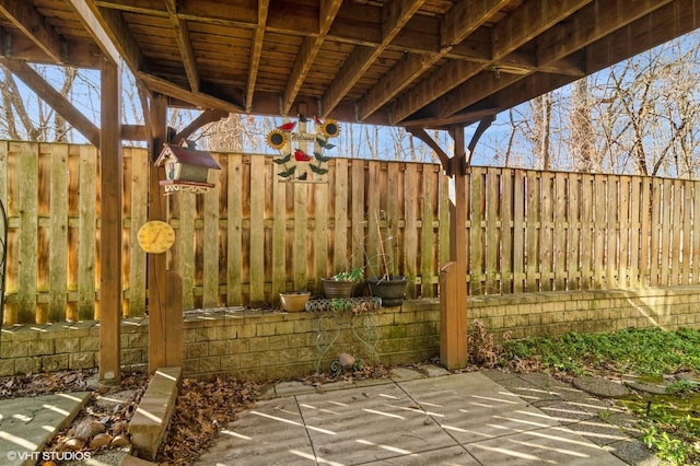 view of patio featuring fence