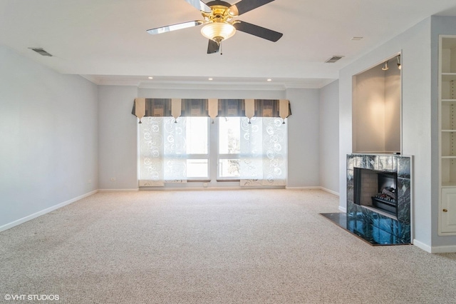 unfurnished living room featuring visible vents, baseboards, and a fireplace