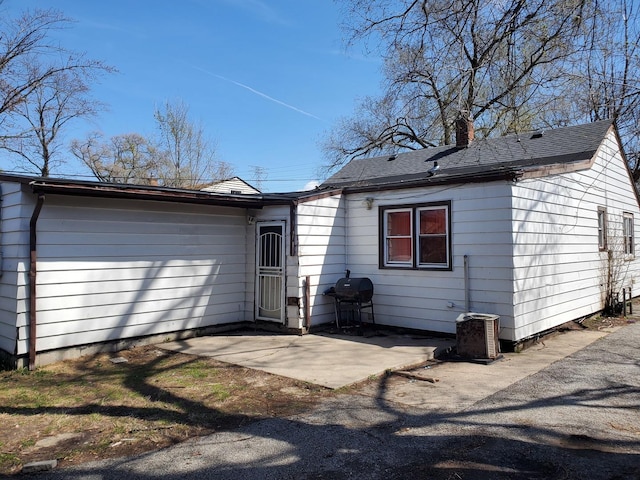 818 Campbell Ave, Calumet City, IL 60409 - back of house with a patio area and a chimney