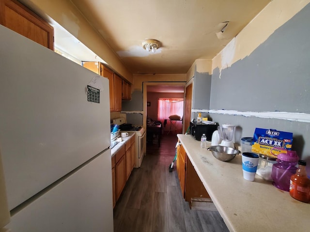 818 Campbell Ave, Calumet City, IL 60409 - kitchen featuring white appliances, dark wood-style floors, and brown cabinets