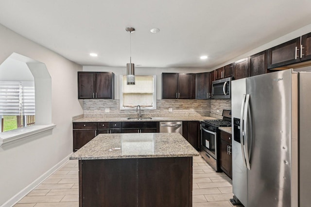 kitchen with plenty of natural light, decorative backsplash, and stainless steel appliances