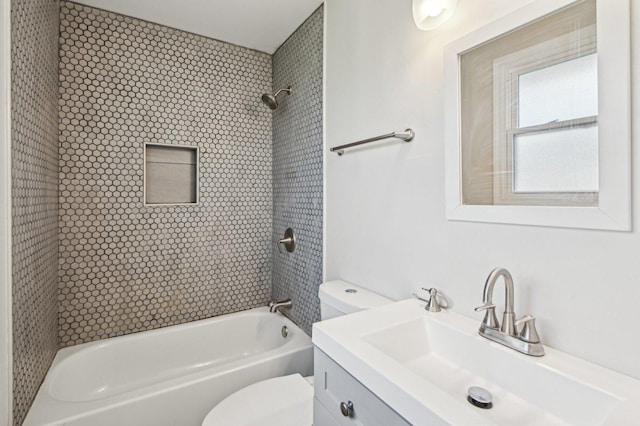 bathroom with shower / bathtub combination, toilet, and vanity