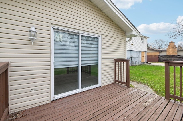 wooden deck with a lawn