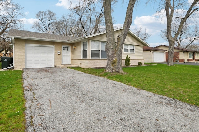 ranch-style home featuring brick siding, a front yard, aphalt driveway, and a garage