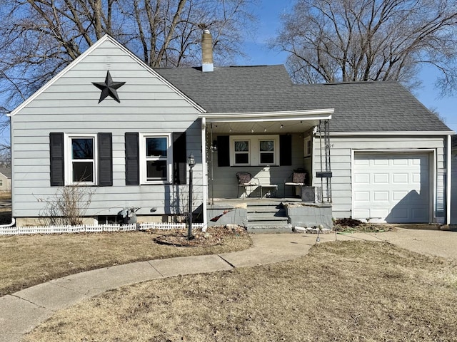 view of front of home with an attached garage, a chimney, and a shingled roof