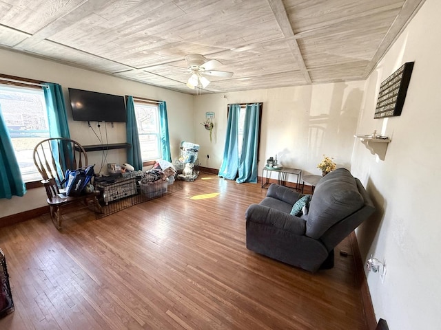 living room featuring wooden ceiling, baseboards, ceiling fan, and hardwood / wood-style flooring