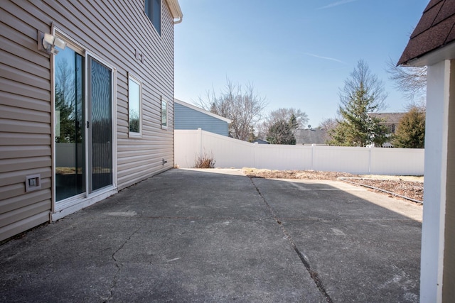 view of patio / terrace featuring fence