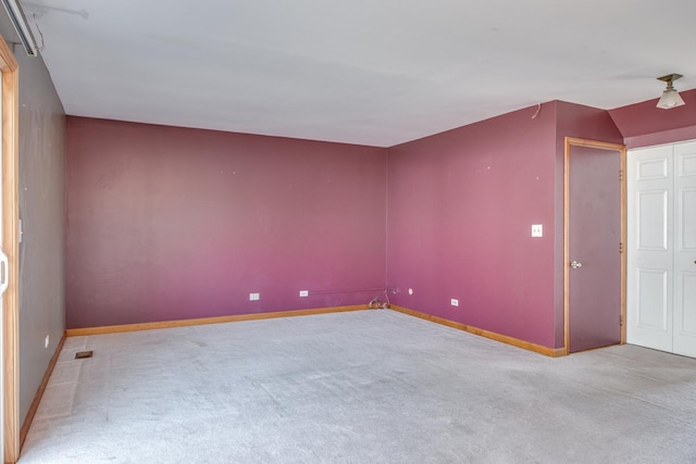 bonus room featuring baseboards and carpet floors