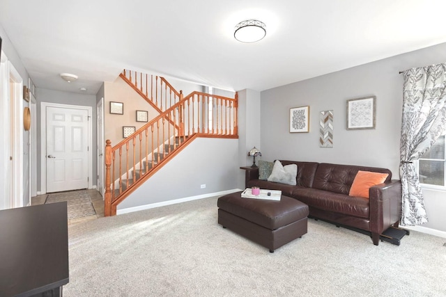 living room featuring stairway, carpet, and baseboards