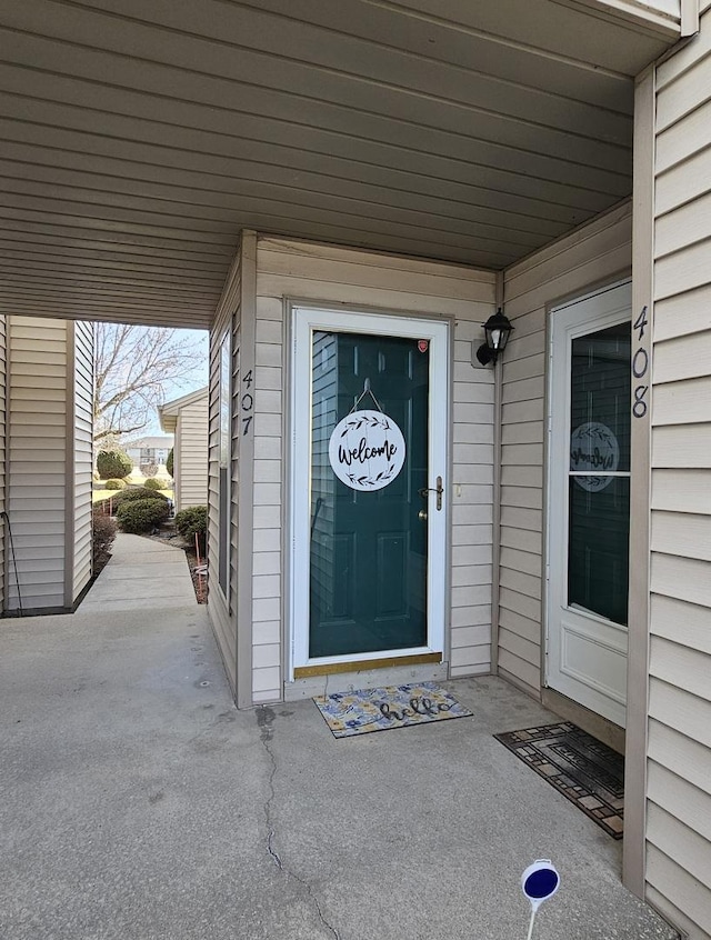 property entrance with a patio area