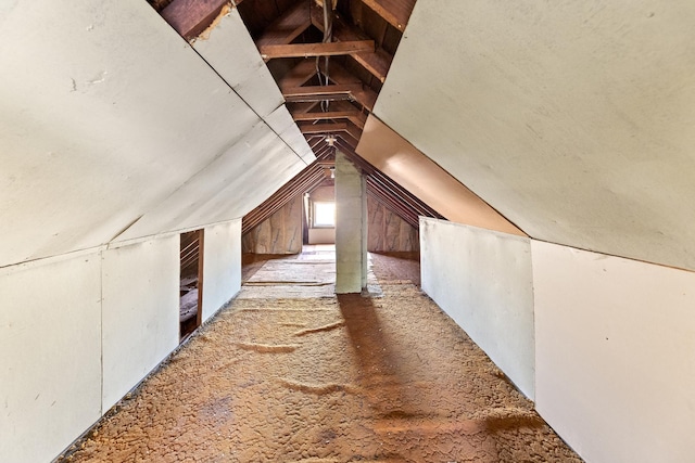 additional living space featuring vaulted ceiling