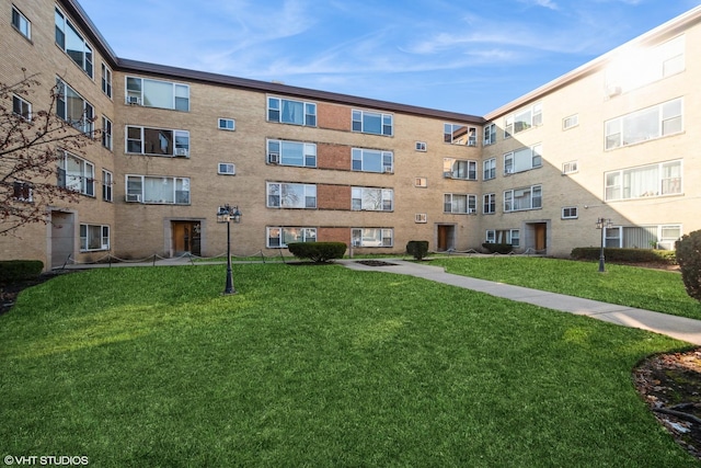 view of community featuring a yard