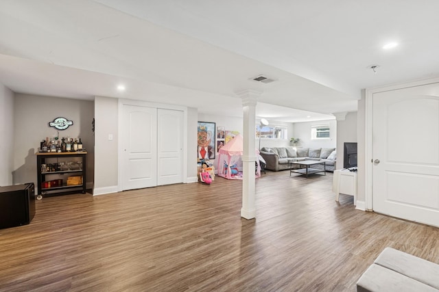 workout area featuring visible vents, recessed lighting, ornate columns, and wood finished floors