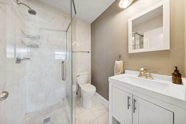 full bathroom featuring a marble finish shower, marble finish floor, toilet, and vanity