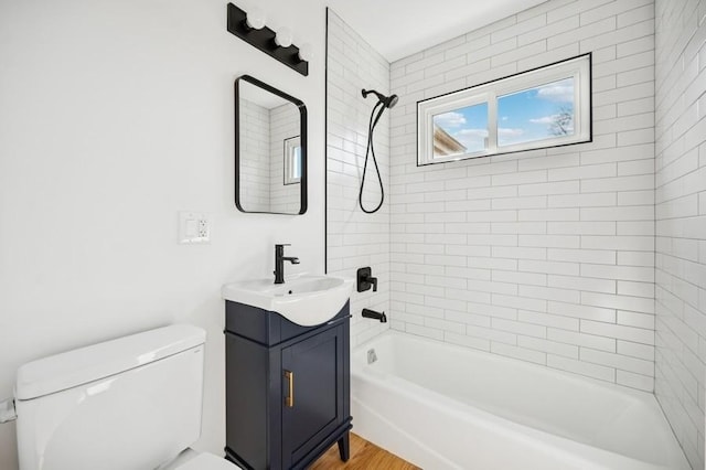 full bath with shower / bathtub combination, toilet, vanity, and wood finished floors