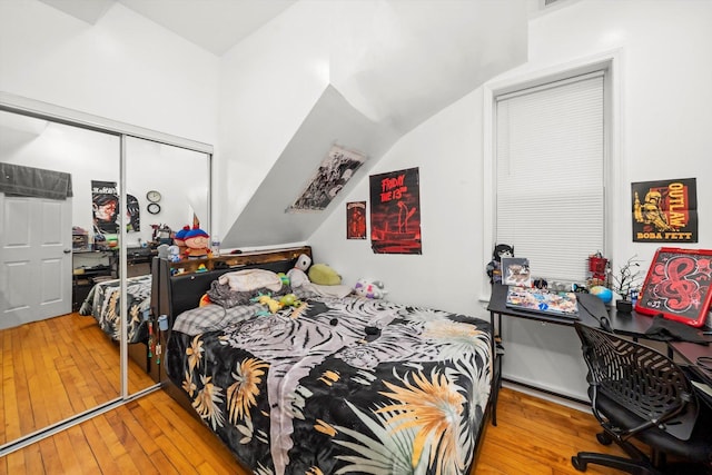 2434 W Pershing Rd, Chicago, IL 60632 - bedroom with a closet, vaulted ceiling, and hardwood / wood-style floors