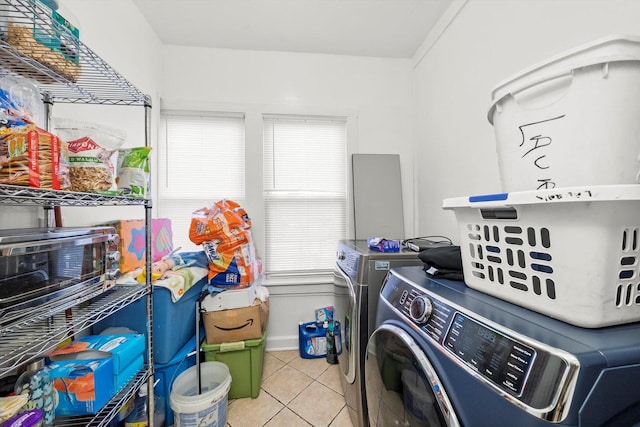 2434 W Pershing Rd, Chicago, IL 60632 - laundry room with tile patterned flooring, laundry area, baseboards, and separate washer and dryer