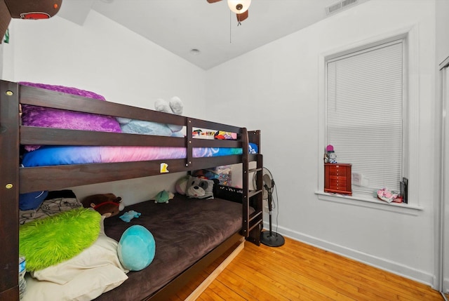 2434 W Pershing Rd, Chicago, IL 60632 - bedroom featuring a ceiling fan, visible vents, baseboards, and wood-type flooring