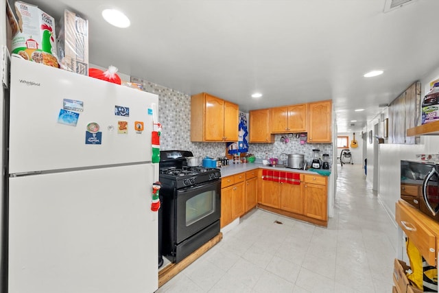 2434 W Pershing Rd, Chicago, IL 60632 - kitchen with black appliances, a sink, recessed lighting, light countertops, and decorative backsplash
