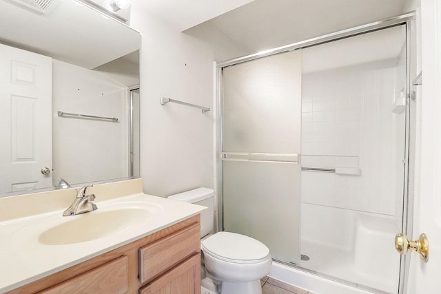 bathroom with an enclosed shower, toilet, visible vents, and vanity