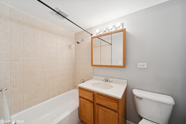 bathroom with vanity, bathing tub / shower combination, and toilet