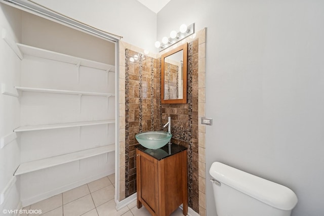 bathroom featuring tile patterned floors, toilet, and vanity