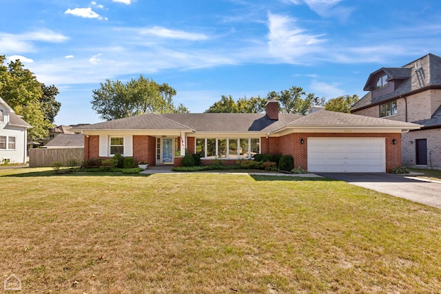 ranch-style home with a garage, brick siding, concrete driveway, and a front lawn