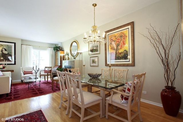1616 S Indiana Ave Unit A2, Chicago, IL 60616 - dining room featuring baseboards, a chandelier, and wood finished floors