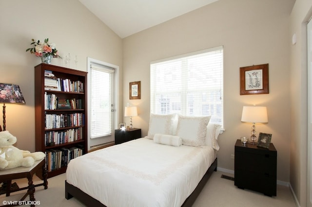 1616 S Indiana Ave Unit A2, Chicago, IL 60616 - bedroom with baseboards, light carpet, visible vents, and vaulted ceiling