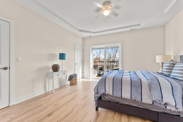 bedroom with a ceiling fan, visible vents, baseboards, light wood-style flooring, and access to outside