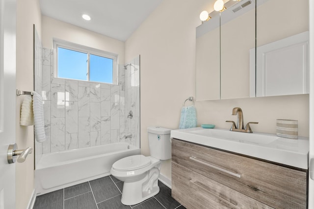 bathroom with vanity, baseboards, visible vents, shower / washtub combination, and toilet