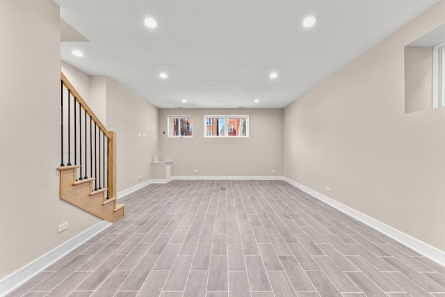 basement with recessed lighting, baseboards, and wood finished floors