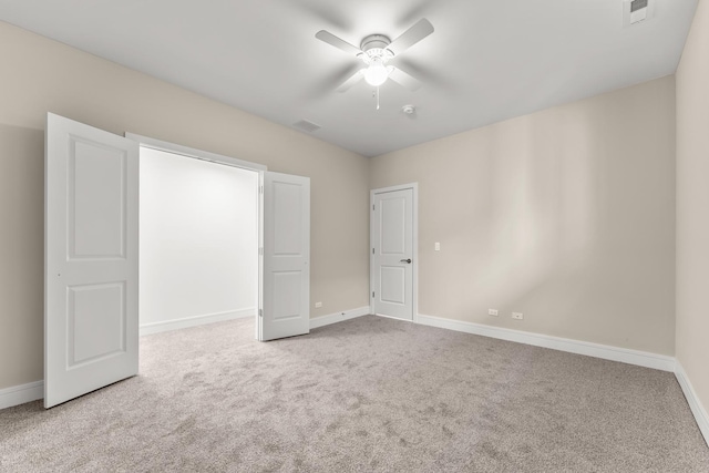 unfurnished bedroom with visible vents, baseboards, and carpet