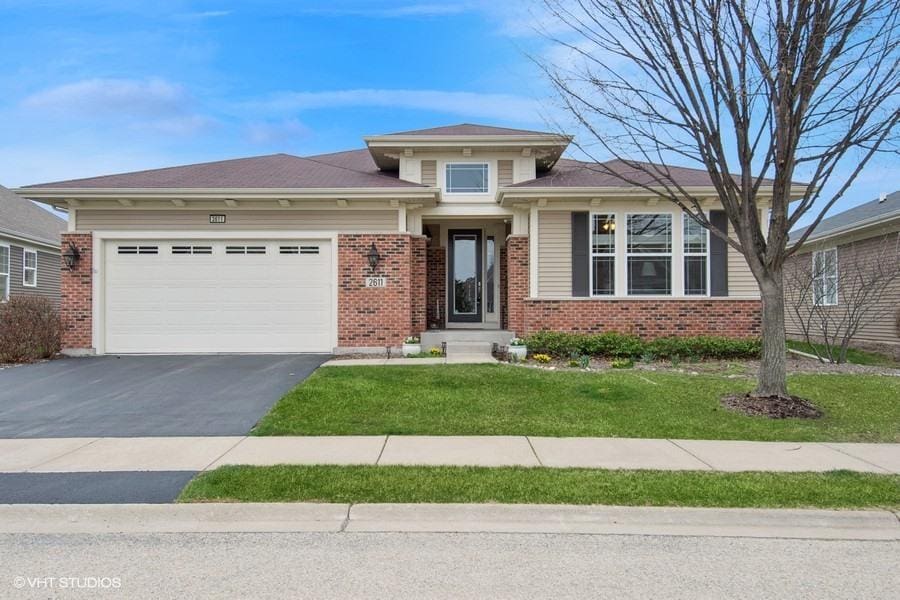 2611 Foxglove St, Naperville, IL 60564 - view of front of property featuring brick siding, a garage, aphalt driveway, and a front lawn