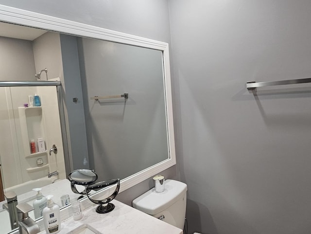 bathroom with toilet and vanity