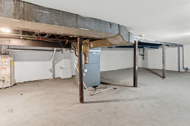 unfinished basement with water heater and heating unit