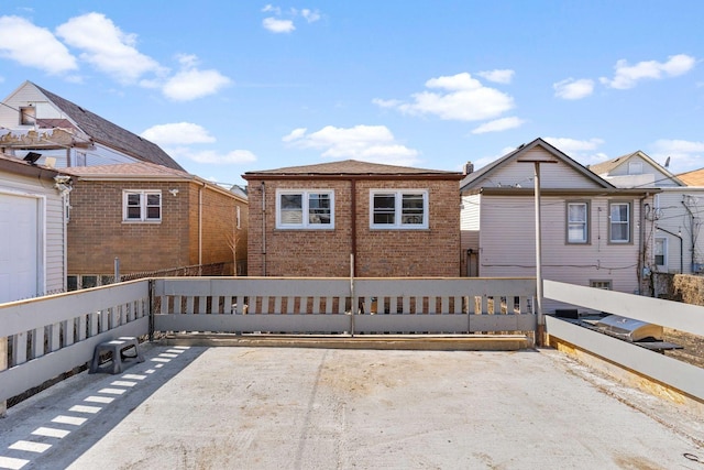 exterior space with brick siding