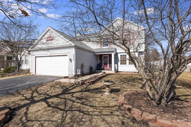 view of front facade featuring aphalt driveway, a garage, and a shingled roof