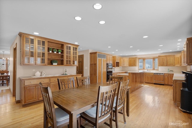 dining area with recessed lighting and light wood finished floors