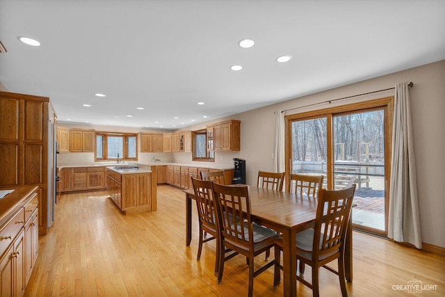 dining area with recessed lighting and light wood-style floors