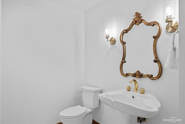 bathroom featuring toilet and a sink